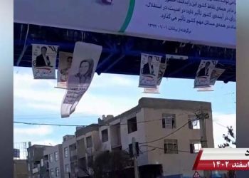 استان البرز- نصب بنر بزرگ خانم مریم رجوی روی پل عابر پیاده در ملارد توسط کانونهای شورشی
